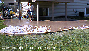 Washing after installing the saw cut control joints